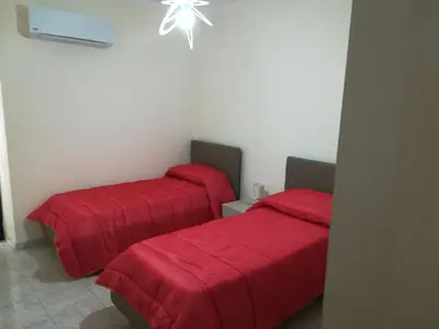 Letto o letti in una camera di La casa di Eva