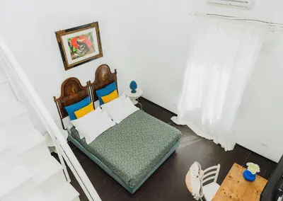 Letto o letti in una camera di Boutique Hotel Molo Santa Lucia