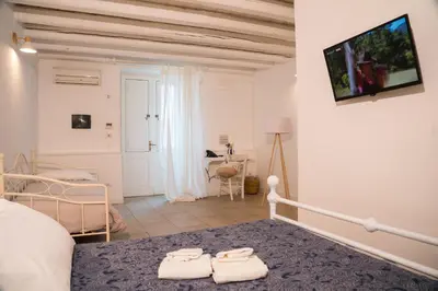 Letto o letti in una camera di Boutique Hotel Molo Santa Lucia