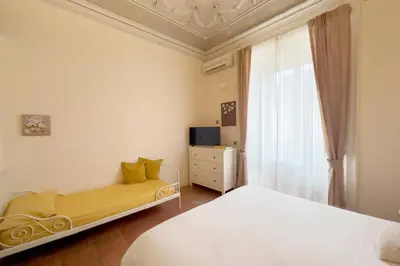 Letto o letti in una camera di Antica Dimora Caruso
