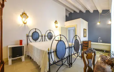 Letto o letti in una camera di Dimora di Catullo - Ospitalità di Charme