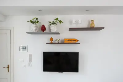 TV o dispositivi per l'intrattenimento presso AM Suite with terrace by Wonderful Italy