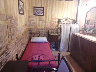 Letto o letti in una camera di la locanda del centro storico