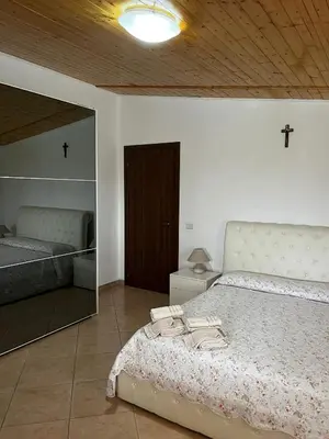 Letto o letti in una camera di Da Delfo