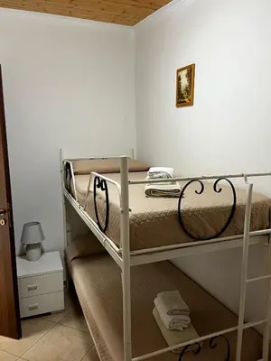 Letto o letti in una camera di Da Delfo