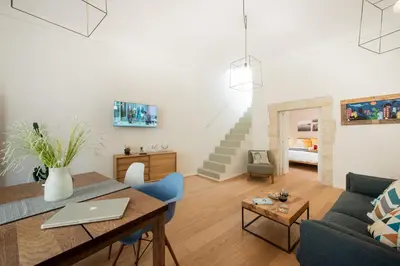 Area soggiorno di Ortigia Suite - Giudecca