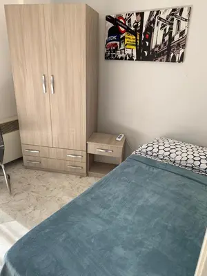 Letto o letti in una camera di Harmony Rooms