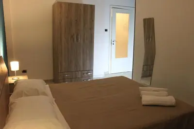 Letto o letti in una camera di Harmony Rooms