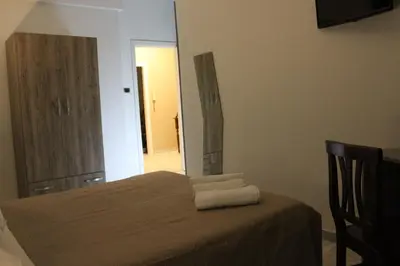 Letto o letti in una camera di Harmony Rooms
