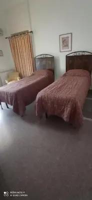 Letto o letti in una camera di Casa Cristina