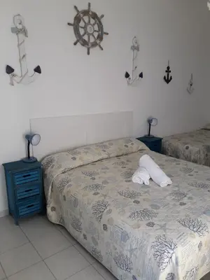 Letto o letti in una camera di Casa Barbara