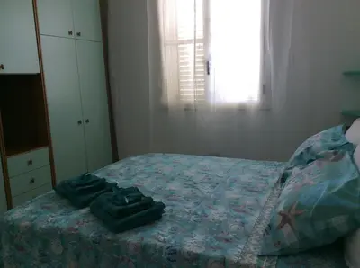 Letto o letti in una camera di Villa Vincenza