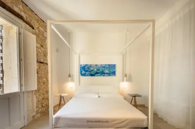 Letto o letti in una camera di Archimede apartments