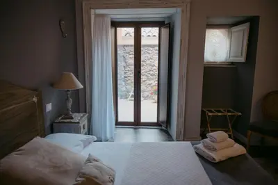 Letto o letti in una camera di La Casa di Alma Luxury rooms