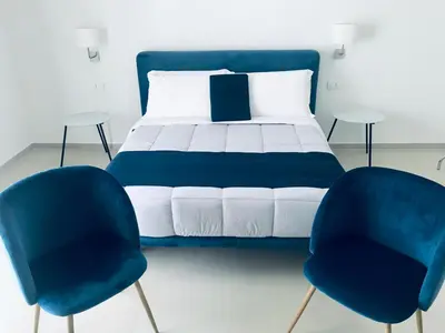 Letto o letti in una camera di Villa Landolina