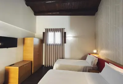 Letto o letti in una camera di Giardino Sul Duomo
