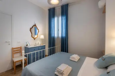 Letto o letti in una camera di Marinella Fronte Mare
