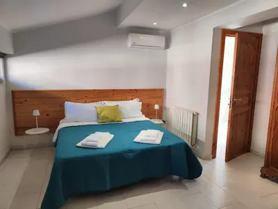 Letto o letti in una camera di Casa La Rosa