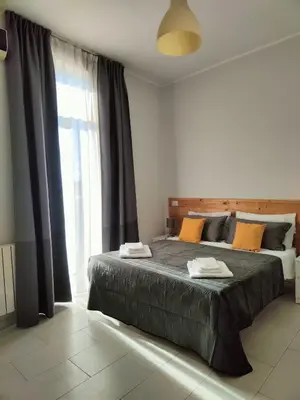 Letto o letti in una camera di Casa La Rosa