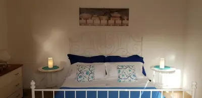 Letto o letti in una camera di Soluzionestate