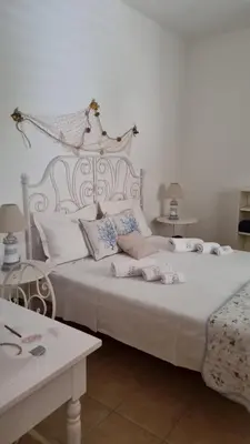 Letto o letti in una camera di Soluzionestate