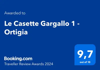 Certificato, attestato, insegna o altro documento esposto da Le Casette Gargallo 1 - Ortigia