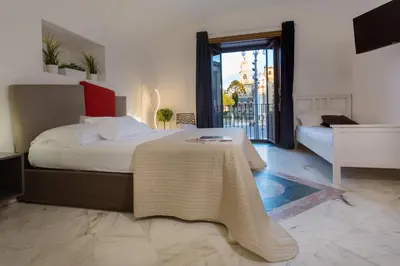 Letto o letti in una camera di Le Suites Del Duomo House