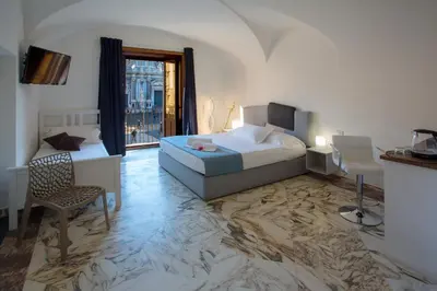 Letto o letti in una camera di Le Suites Del Duomo House
