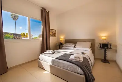 Letto o letti in una camera di Holiday Fontane Bianche Gabriella