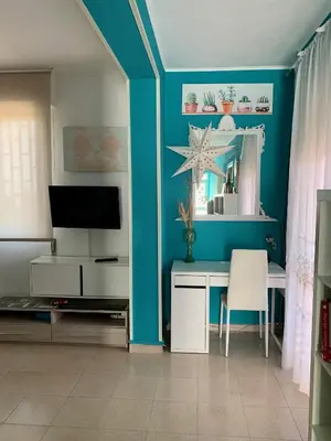 TV o dispositivi per l'intrattenimento presso Acquamarina Apartment