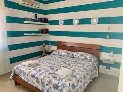 Letto o letti in una camera di Acquamarina Apartment