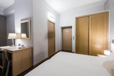 Letto o letti in una camera di BeBIGEA Rooms
