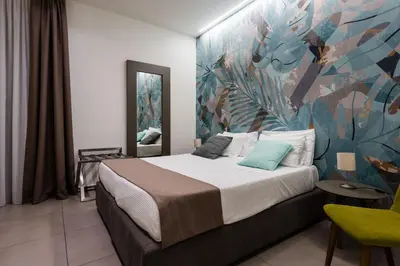 Letto o letti in una camera di BeBIGEA Rooms