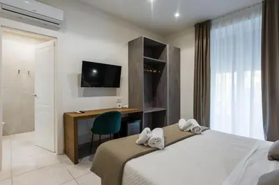 Letto o letti in una camera di BeBIGEA Rooms