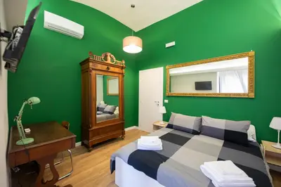Letto o letti in una camera di Uzeda Inn Apartment