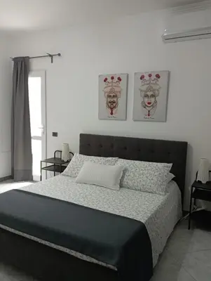 Letto o letti in una camera di La casetta di viale Paradiso