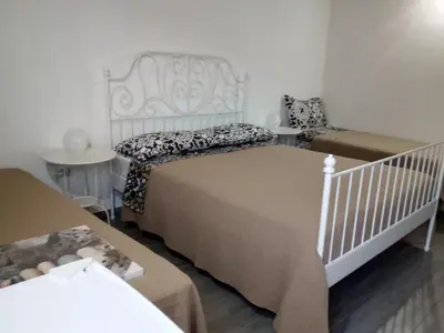 Letto o letti in una camera di La casetta di viale Paradiso