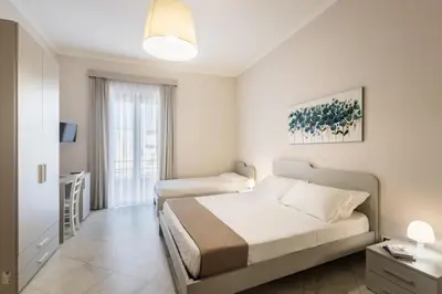 Letto o letti in una camera di Nonna Nina