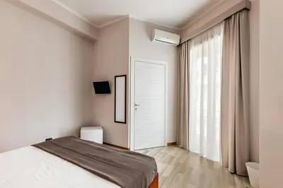 Letto o letti in una camera di Nonna Nina