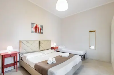 Letto o letti in una camera di Nonna Nina