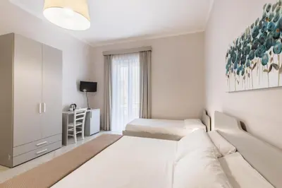 Letto o letti in una camera di Nonna Nina