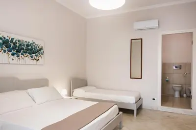 Letto o letti in una camera di Nonna Nina