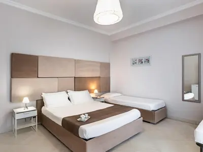 Letto o letti in una camera di Nonna Nina