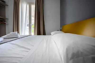 Letto o letti in una camera di Serafini Rooms