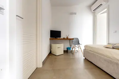 Letto o letti in una camera di Serafini Rooms