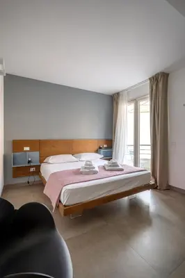 Letto o letti in una camera di Serafini Rooms