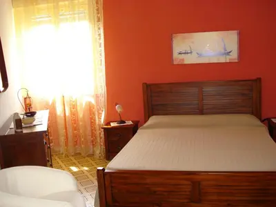 Letto o letti in una camera di Villa La Bussola