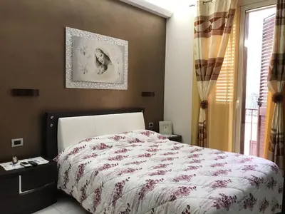 Letto o letti in una camera di Casa Angela