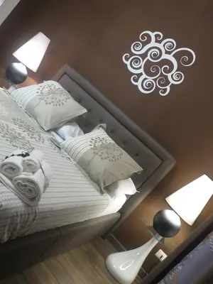 Letto o letti in una camera di Symposium Bed&Breakfast