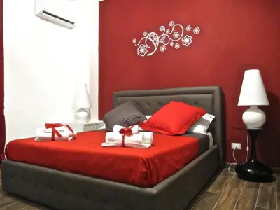 Letto o letti in una camera di Symposium Bed&Breakfast